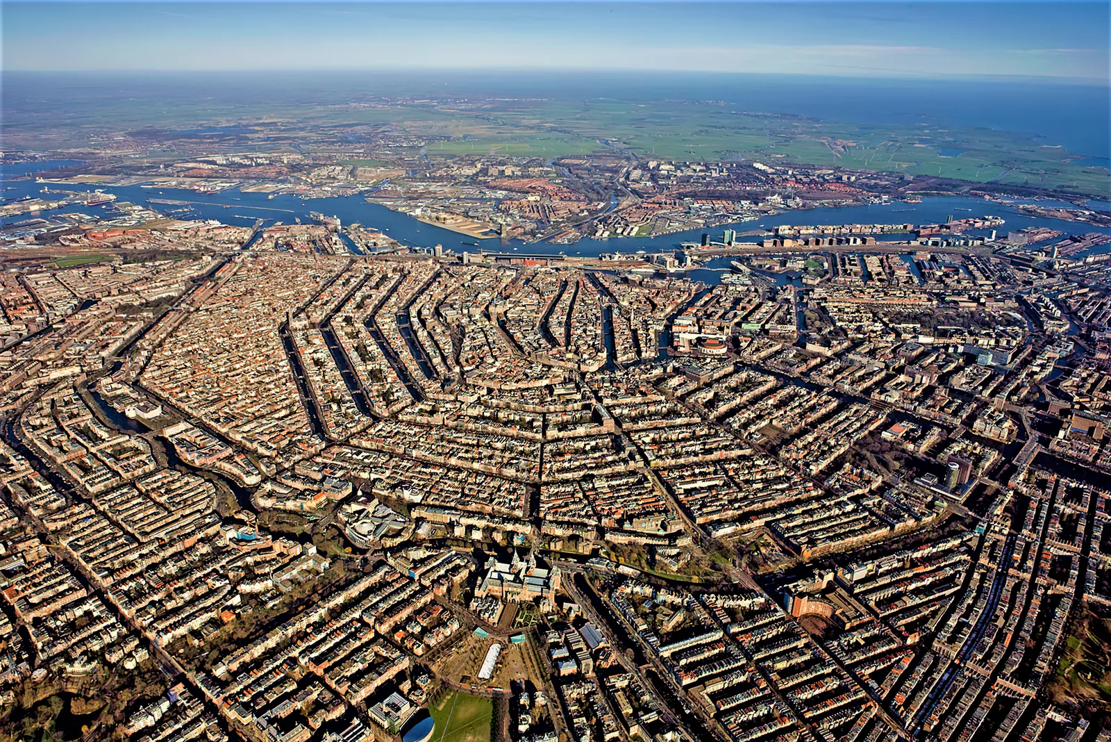 Amsterdam canal belt with historic canal houses and trees seen from above