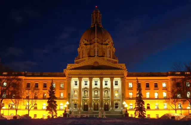 Alberta Legislature Building illuminated at night in Edmonton
