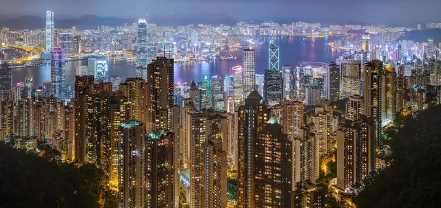 Hong Kong harbour and skyline illuminated at night, viewed from Victoria Peak