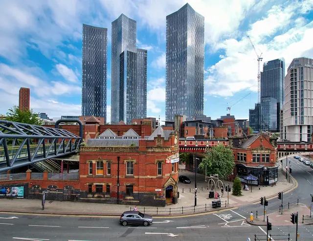 Manchester skyline with Deansgate Square towers and historic Knott Mill station